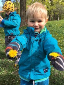 boys playing with flowers