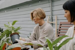 Image Source: https://www.pexels.com/photo/a-woman-repotting-a-plant-9724438/ 
