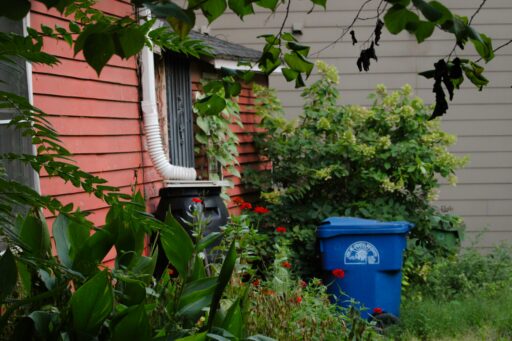 Strategies to Manage Waste After Home Exterior Projects
picture: https://unsplash.com/photos/a-blue-trash-can-sitting-next-to-a-red-house-8yxYh0l4bvg